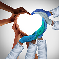 Hands wearing medical gloves form shape of a heart
